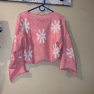 Super trendy flower pink sweater!! I love this sweater but it is too big